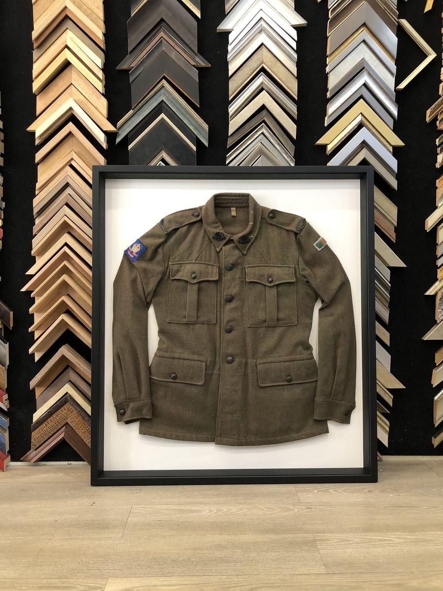 WWII military uniform framed in large shadow box